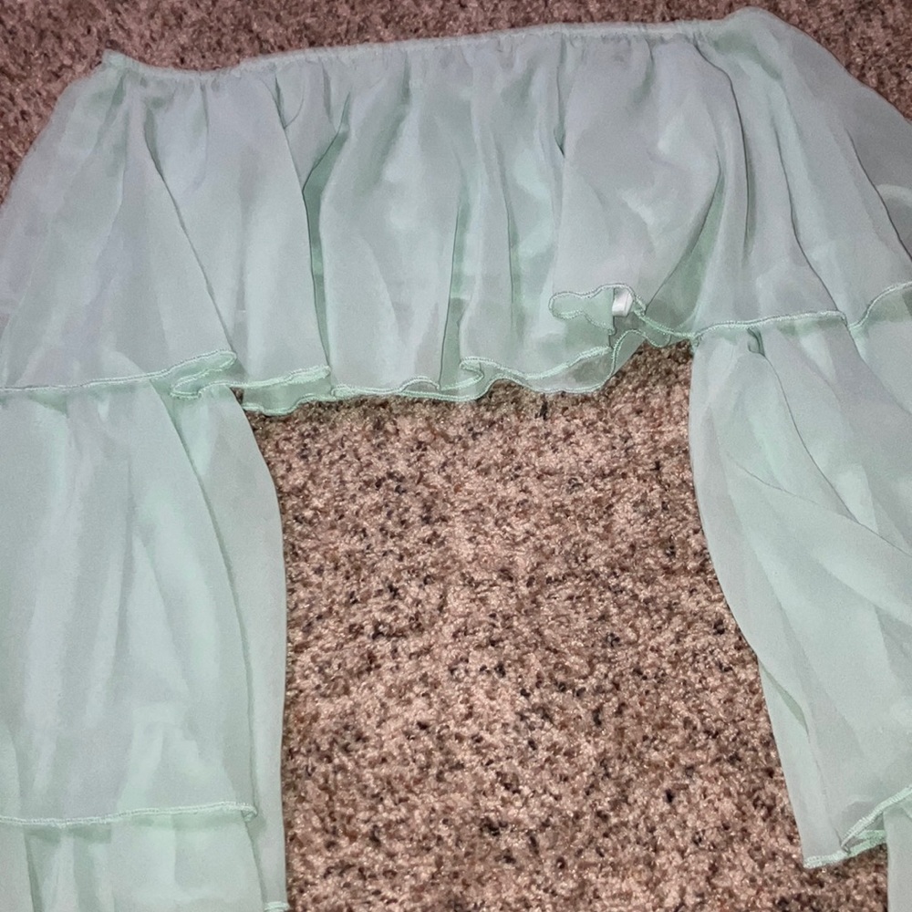 Green flared arms